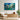 Framed horizontal blue floral abstract painting bringing magical starry garden vibes above a contemporary console table in a living room.