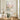 Soft pastel abstract flower artwork with heavy impasto texture creating a peaceful romantic atmosphere in a modern wooden dining room design.