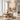 Warm peach and slate blue impasto landscape canvas art creating a serene and cozy atmosphere above a wooden dining table in a contemporary space.