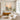 Large framed impasto sunset canvas wall art with blush pink sky and blue earth tones displayed in a contemporary minimalist living room setup.