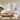 Hand painted pastel abstract canvas painting set of 2 with thick knife texture hanging side by side over a cream sofa in a bright living room.