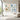 Framed 3D impasto abstract diptych wall art set displaying rich warm beige and ocean blue palette knife strokes above a living room sideboard.