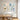 Dual tone pastel abstract canvas artwork set of 2 creating a refined harmonious atmosphere above a wooden dining table in a modern home.