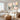 Framed 3D impasto pastel flower abstract wall art set displaying rich palette knife strokes above a light wooden sideboard in a living room.