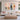 Framed gold leaf abstract cloud oil painting set showing burnt orange knife strokes over a sleek wooden console table in a living room.