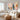 Large 2 piece ethereal sky abstract diptych wall art set featuring indigo blue accents displayed in a luxury minimalist living room interior.