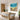 Bright abstract ocean and garden acrylic painting displayed in modern dining room, creating warm joyful atmosphere for family meals.