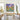 Striking hand-painted cosmic landscape artwork decorating long hallway gallery wall, welcoming guests with energetic glowing art vibes.