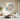Hand painted blue pink hydrangea floral square oil painting with heavy knife texture hanging over a beige sofa in a modern living room.
