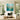 Hand painted mint green wildflower square oil painting with white frame hanging over a sofa in a bright modern organic living room.