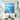 Large sunny tropical ocean seascape canvas painting hanging in a bright double-height dining room with a round marble table.